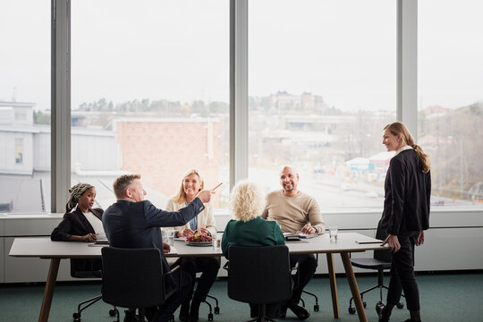 Business people having meeting in boardroom
