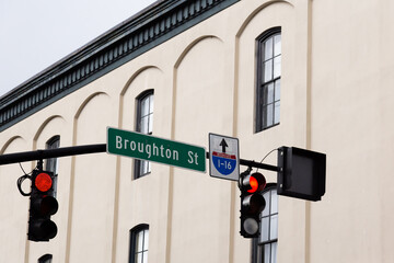 Low angle selective focus view of Broughton street and Interstate 1-16 sign, Savannah, Georgia, USA