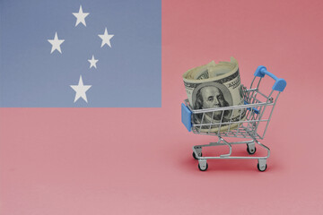 Metal shopping basket with dollar money banknote on the national flag of Samoa background. consumer...