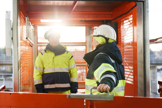 Engineers talking at building site