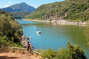 Fototapeta na wymiar canoeing in Cedrino lake, Dorgali, Sardinia, Italy