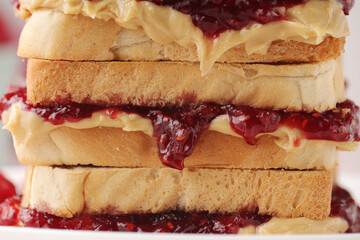 Sandwiches with peanut butter and raspberry jam