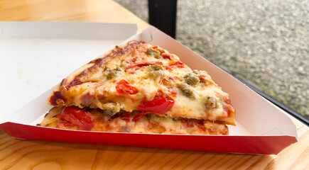 one pizza slice traditional finger gourmet food representing unhealthy eating and junk food 