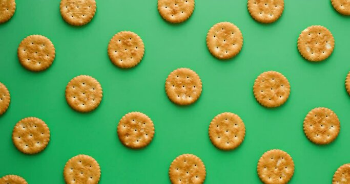 Cookie pattern on a green background. Looped 4k stop motion animation