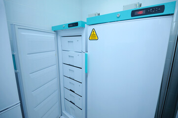 At the Human Milk Bank laboratory. Freezer with breast milk storage containers inside