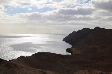Panoramic view of the Cuchillos de Vigán and the desert land over the Atlantic ocean in Fuerteventura
