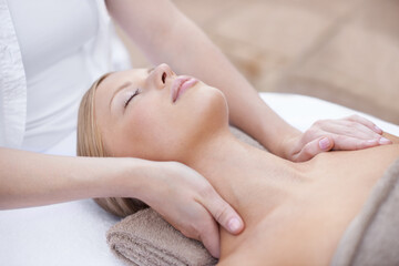 Fototapeta na wymiar Nothing beats a good spa treatment. A young woman enjoying a relaxing massage.