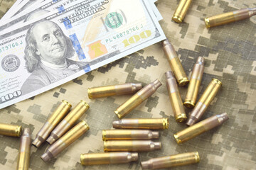 American dollars banknotes on military pixel background.