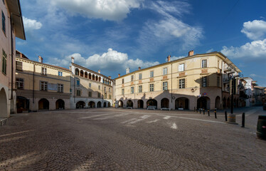 Fototapeta na wymiar Racconigi, Cuneo, piedmont, Italy - Piazza Vittorio Emanuele II known as Piazza degli Uomini, the old commercial centre of the city with ancient buildings