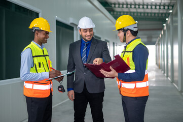 Diverse Team of Specialists Taking a Walk Through factory Site. Real Estate Building Project with Senior Civil Engineer, Architect, General Worker Discussing Planning and Development Details.