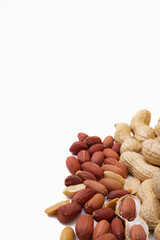 Peanuts in shell isolated on white background. Heap of peanuts close up	