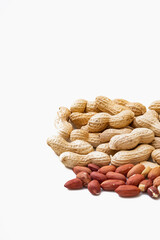 Peanuts in shell isolated on white background. Heap of peanuts close up	