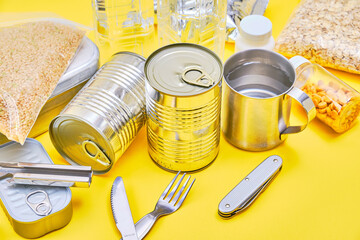 Disaster preparation food on yellow background.