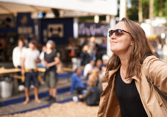 Obraz premium Time to get your summer on. a young woman enjoying a day in the sunny outdoors.