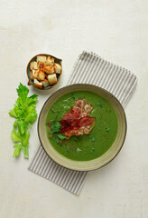 green mashed soup, with bacon and croutons, homemade, no people,