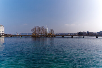 Rhone River with Mont Blanc bridge in the background at Swiss City of Geneva on a sunny winter day. Photo taken March 5th, 2023, Geneva, Switzerland.