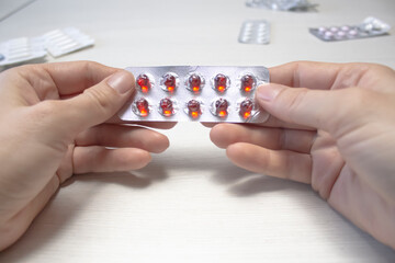 A woman holding a medicine in her hands on a transparent PNG layer. Medicine concept.