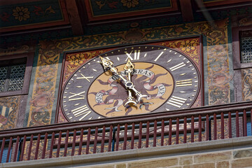 Close-up of clock face of stone clock tower at pont de l'Ile at Swiss City of Geneva on a sunny...