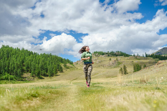 Woman running in the countryside 