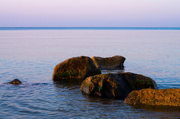 coastal stones in the sea beach at dawn