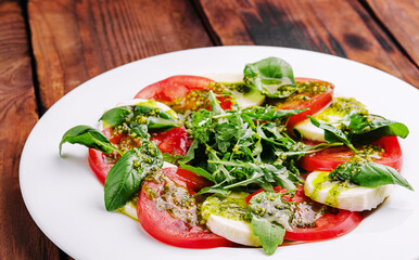 Traditional italian caprice salad tomato, mozzarella cheese and basil
