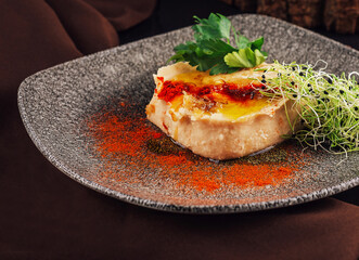 Hummus with olive oil and paprika