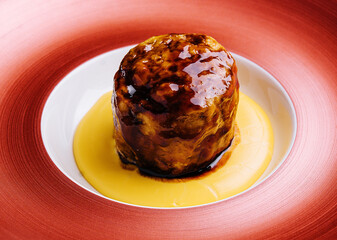 Beef medallion steak on red plate