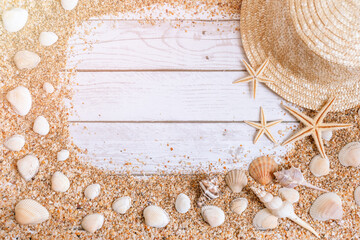 Sand seashells background. Summer time concept with sea shells and starfish on wooden background and sand