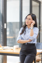 Young asian woman, professional entrepreneur standing in office clothing, smiling and looking confident, plan office space after working hours,