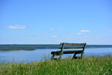 An empty bench on a top of the hill with the view to the Volga river isolated  
