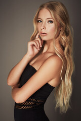 Naklejka premium Summer fashion. Cropped portrait of an attractive young woman posing confidently in the studio.