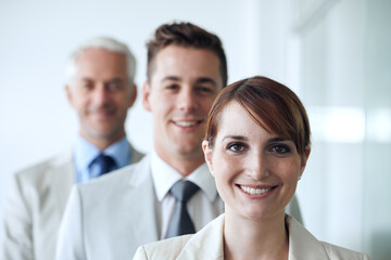 We make success a reality. Portrait of a group of confident-looking executives.