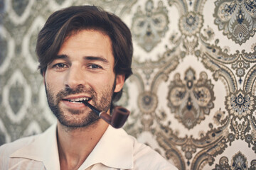 Not too shabby, eh. Cropped portrait of a handsome man in retro 70s clothing smoking a pipe against...