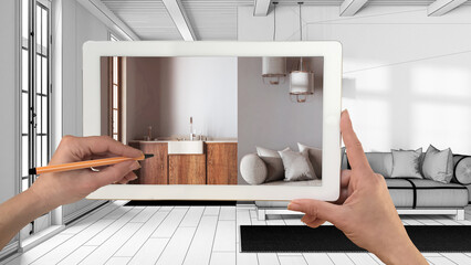 Fototapeta na wymiar Augmented reality concept. Hand holding tablet with AR application used to simulate furniture products in custom architecture design, black ink sketch, living room and kitchen