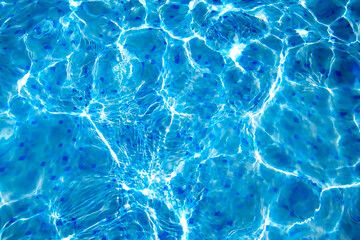Surface of blue swimming pool, abstract background of water in swimming pool.
