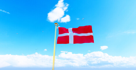 Denmark flag waving in beautiful sky. Flag of Denmark waving in the wind, sky and sun background. Denmark Flag. UHD. 