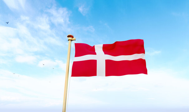 Denmark flag waving in beautiful sky. Flag of Denmark waving in the wind, sky and sun background. Denmark Flag. UHD. 