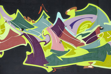 Colorful background of graffiti painting artwork with bright aerosol strips on metal wall. Old...