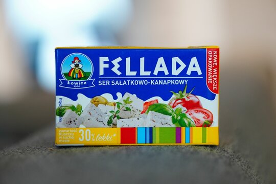 Shot of a white, packaged Fellada food box on a blurred background.