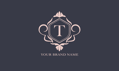 Exquisite baroque pattern. Floral ornament with initial letter T. Vintage frame, greeting card, wedding invitation. Vector logo template, label, business sign.