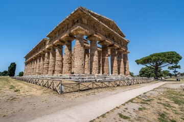 Fototapeta na wymiar Ancient doric colonnades of the first Hera Temple of Paestum, Campania, Italy, side view