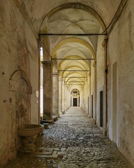 Obraz premium Vertical image of an entrance of a monastery in Certosa di Padula, Campania region, Italy