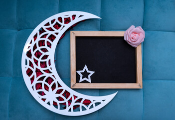 Eid Mubarak background 2023, Crescent moon with black board and copy space for Greeting Text