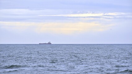 Ferry in the background of the sea on a cloudy day