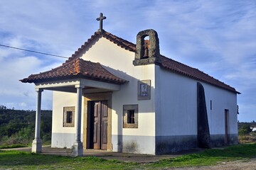 Beautiful white chapel isolated against the blue sky