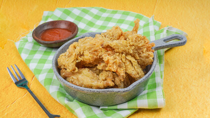 Homemade Deep Fried Mushrooms with Dipping Sauce on yellow background
