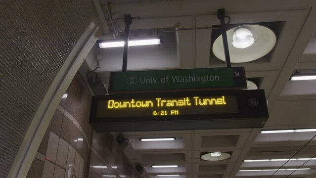 Panning shot of navigational sign at subway station in Seattle Washington