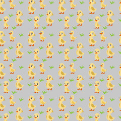 A pattern of yellow ducks on a gray background.