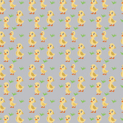 A pattern of yellow ducks on a gray background.