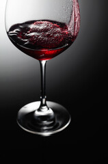 Closeup of red wine pouring.
